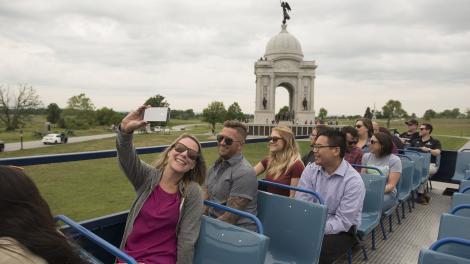 Touring Gettysburg National Military Park in Pennsylvania via open-air bus