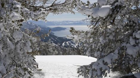 View from the top of a mountain with the lake in the background at Lake Tahoe