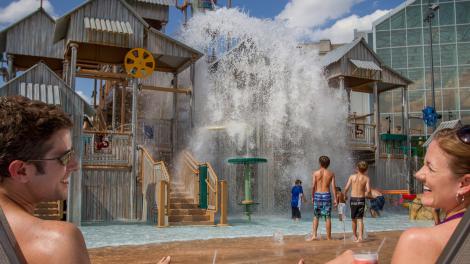 Couple watching as kids play at Cypress Springs Water Park in Gaylord Palms Resort and Convention Center in Kissimmee, Florida