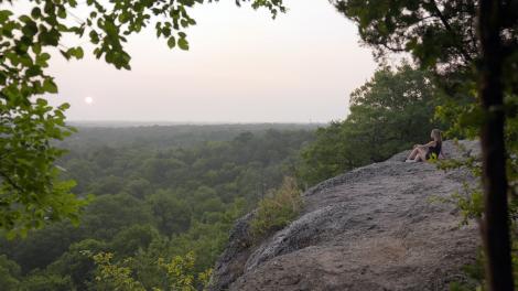 Watching the sunrise from an overlook in Chickasaw National Recreation Area in Oklahoma