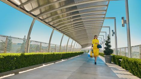Shopper on the Unity Bridge at South Coast Plaza in Costa Mesa, California Shopper on the Unity Bridge at South Coast Plaza in Costa Mesa, California