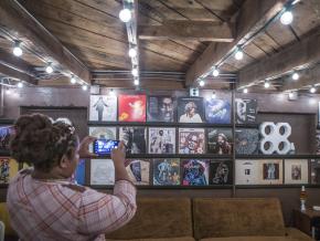 Viewing record album covers inside Muscle Shoals Sound Studio