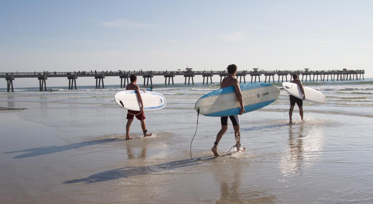 Surfers checking out the waves at Jacksonville Beach