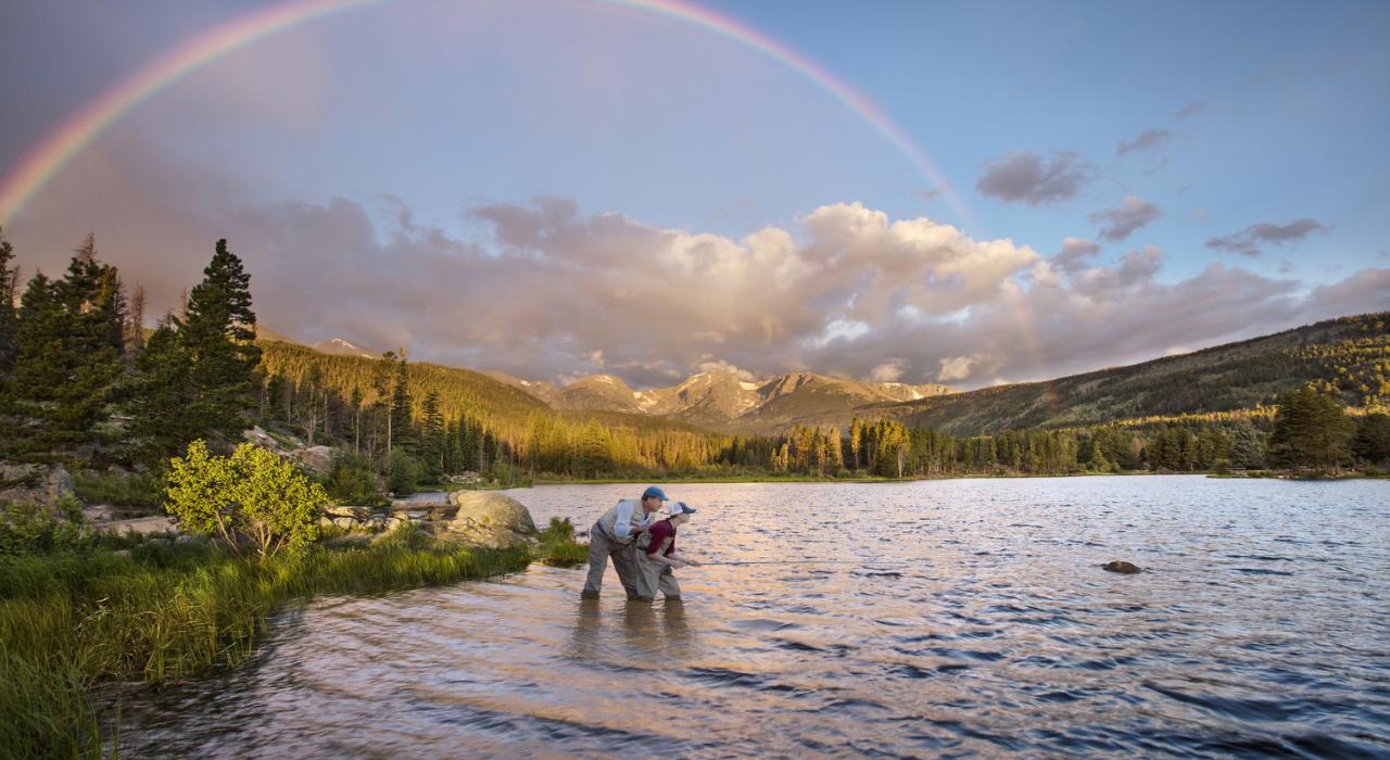 Fly-fishing for rainbow trout in Sprague Lake in Rocky Mountain National Park Fly-fishing for rainbow trout in Sprague Lake in Rocky Mountain National Park