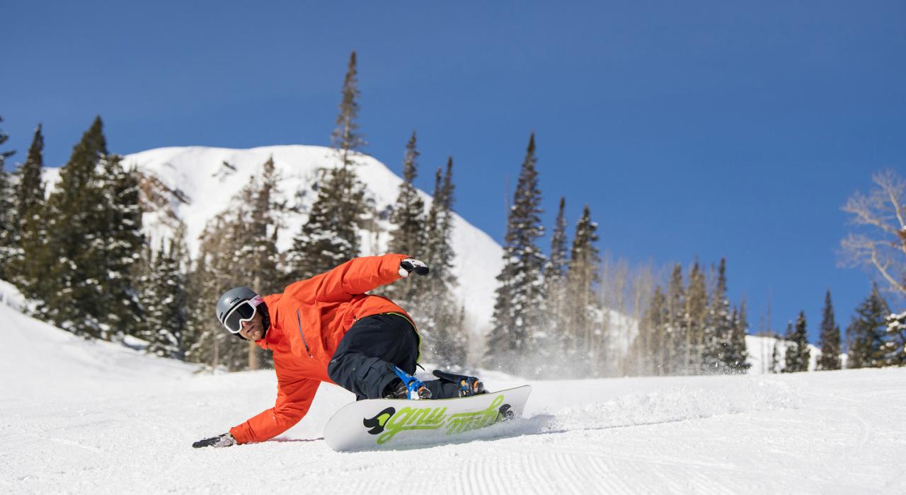 Snowboarding on a perfectly groomed slope