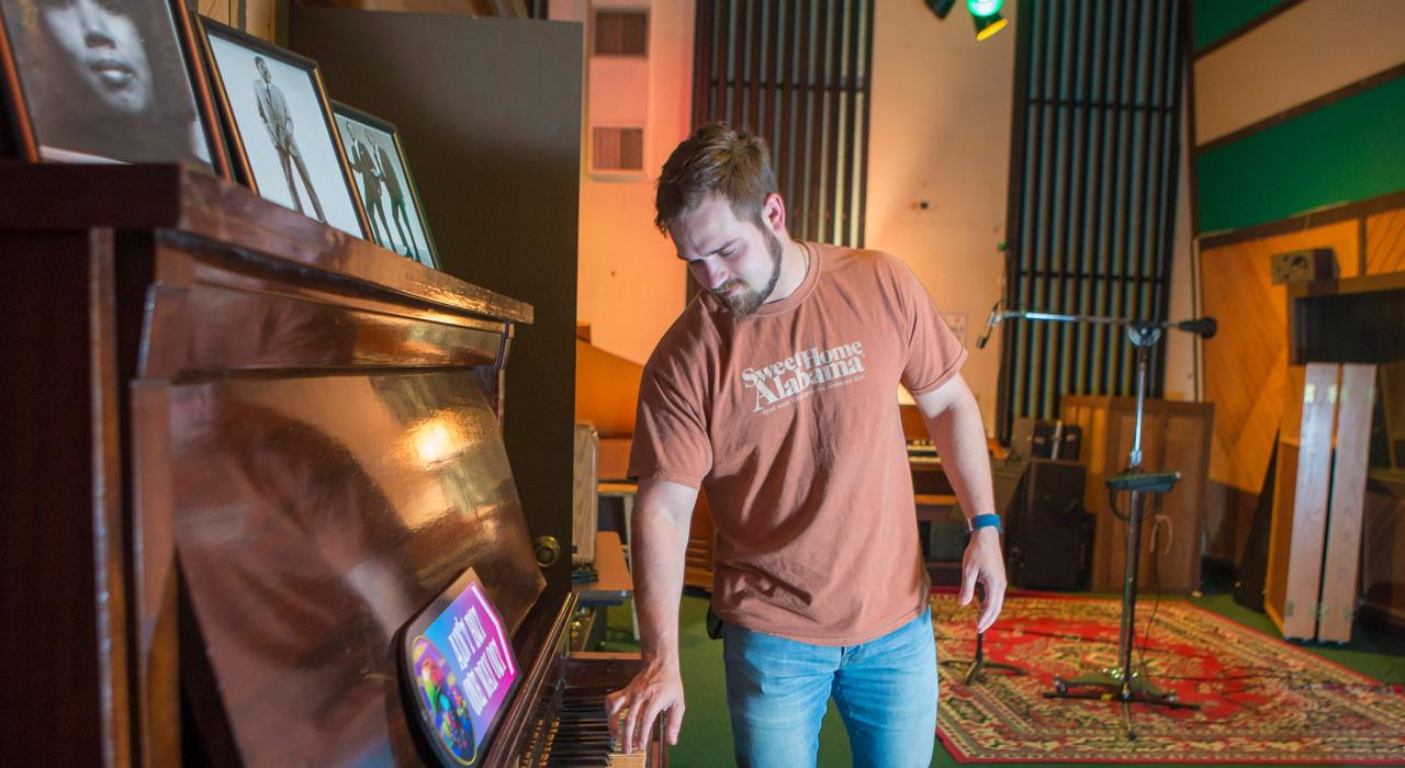 Touching the ivories at FAME Recording Studios in Muscle Shoals