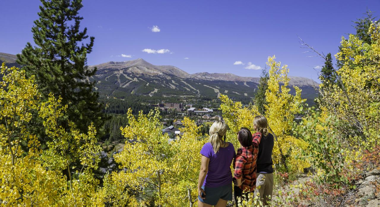 Admiring the view of the town during an autumn hike